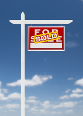 Right Facing Sold For Sale Real Estate Sign on a Blue Sky with Clouds.