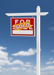 Left Facing Sold For Sale Real Estate Sign on a Blue Sky with Clouds.