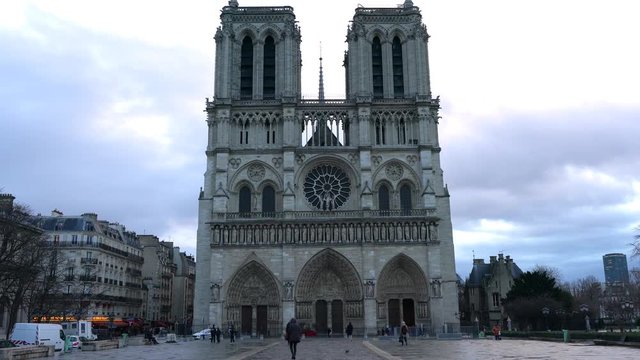 Paris,France-January 19, 2018: Thanks to a rain shower, shadow of Notre Dame de Paris is recognizable on the surface of wet stone pavement.