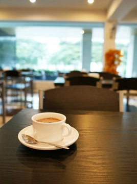 White Coffee Cup On The Table In Restaurent Background