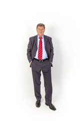 Obraz premium smiling mature businessman standing