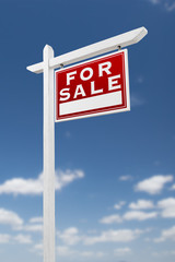 Right Facing For Sale Real Estate Sign on a Blue Sky with Clouds.
