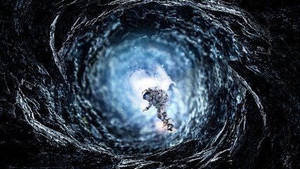 Space hole and astronaut. Mixed media