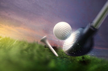 hitting golfball on grass field