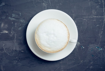 Cup of coffee on the rustic wooden background. Selective focus. Shallow depth of field.