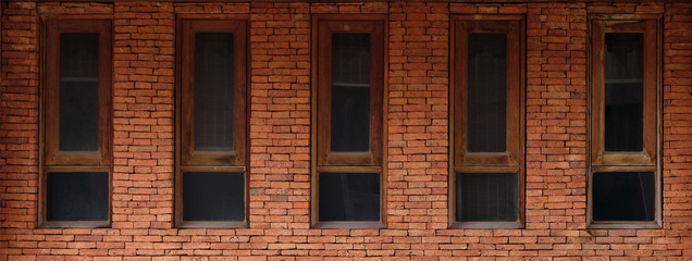 old wooden window frames with red bricks wall, background