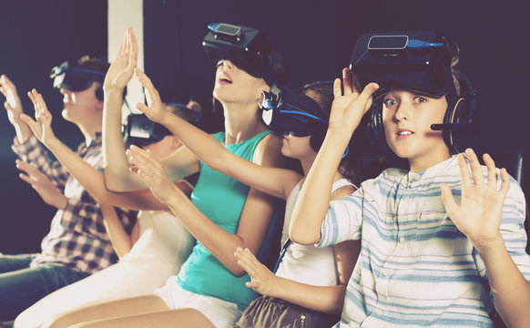 Boy is fascinated by movie in virtual reality glasses