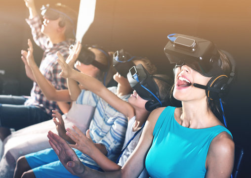 Mother is enjoying movie in virtual reality glasses