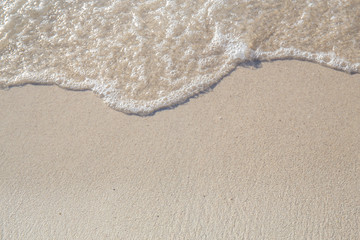 The movement of the waves on the sand is smooth and fine for  background,Soft focus