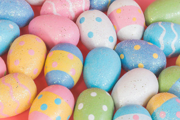 Fototapeta na wymiar Colorful easter eggs on pastel color background.