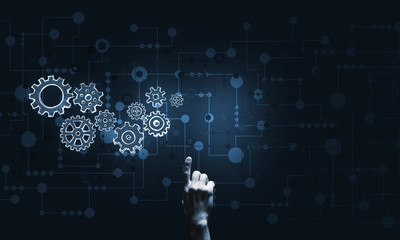 Glowing cogwheel mechanism icon on dark background as symbol of teamwork