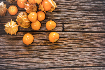 Cape gooseberry sweet fruits scene on wood table background