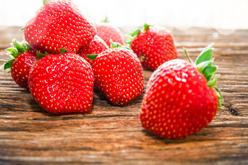 Close up strawberry fruits scene on wood table background