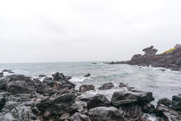Fototapeta na wymiar Dragon Head Rock dark or Yongduam of Jeju Island South Korea 