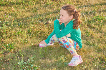 Little girl on grass