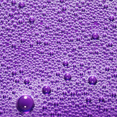 Bubbles on a glass surface. Abstract liquid bubbles background. 