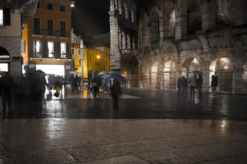 Old European illuminated city at rainy night