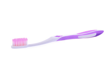 new purple toothbrush isolated on white background