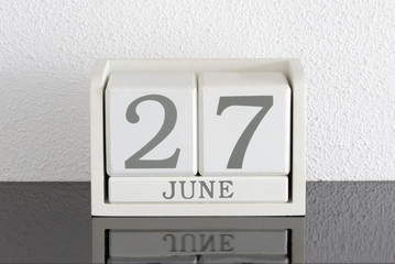 White block calendar present date 27 and month June