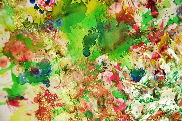 Watercolor paint colorful abstract background in green, pink, red, yellow hues and colors