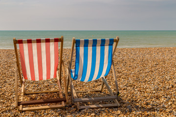 Empty deck chairs at Brighton Beach, East Sussex, UK
