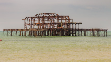 The remains of West Pier, seen from Brighton Beach, East Sussex, England, UK