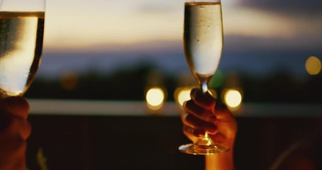 Couple celebrating drinking champagne at sunset - Powered by Adobe
