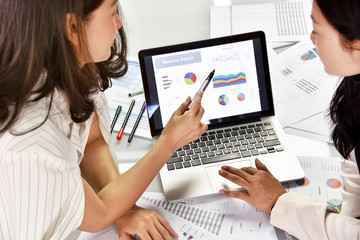 Business strategy planning, Business women discuss and review data documents, Business chart and...