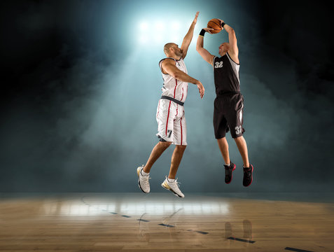 Caucassian Basketball Player in dynamic action with ball in a pr