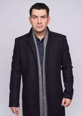 Fototapeta premium Serious man wearing coat. isolated