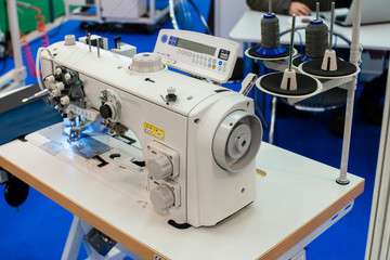 Industrial sewing machine close-up, shallow dof