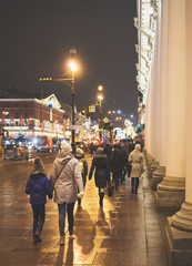 People walk along the Nevsky Prospekt in St. Petersburg.