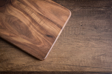 Old Cutting Board on wooden table.