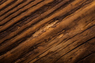 Rough weathered wooden board. Rustic texture for background. Toned