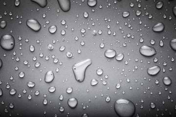 Drops of water on a color background. Gray. Toned