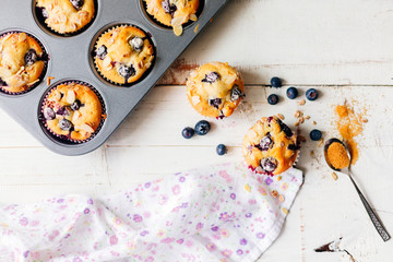 Homemade blueberry muffins on white table