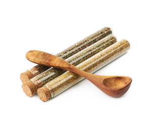 Herbal spices in a glass vial isolated