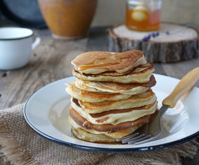 Pancakes with honey in a plate