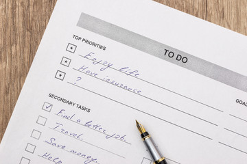 to do list with pen on desk