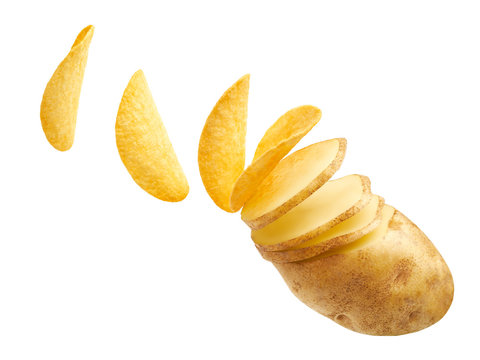 Potato slices turning into chips isolated
