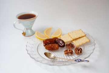 Breakfast-coffee and sweets on a glass plate