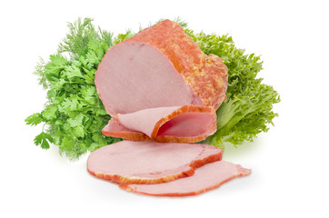 Partly sliced smoked ham against of a different greens