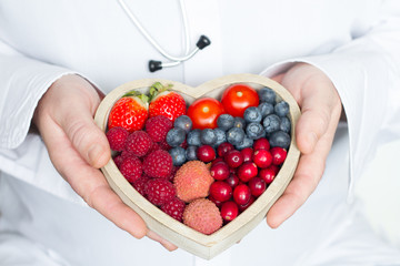  Doctor and stethoscope with heart healthy diet food abstract medicine concept