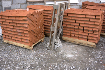 Red clay brick, standing in the stacks .