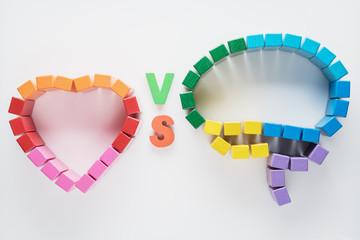 Heart vs Mind. Heart versus brain. Concept of mind against love.