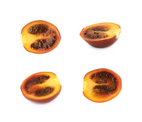 Half of a ripe tamarillo fruit isolated
