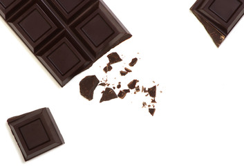 Broken chocolate bar isolated on white