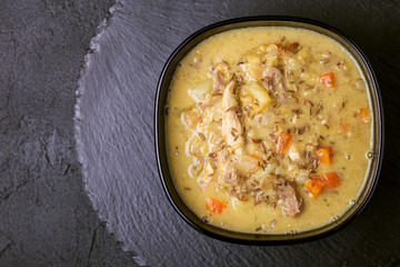 Indian Mulligatawny soup with lentil, parsley. Copyspace, top view.