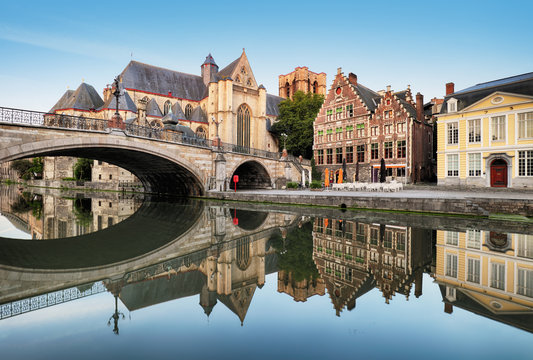 Gent - Medieval cathedral and bridge over a canal in Ghent, Belgium