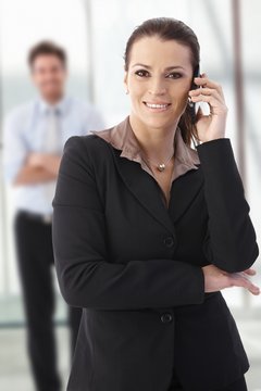 Happy businesswoman calling